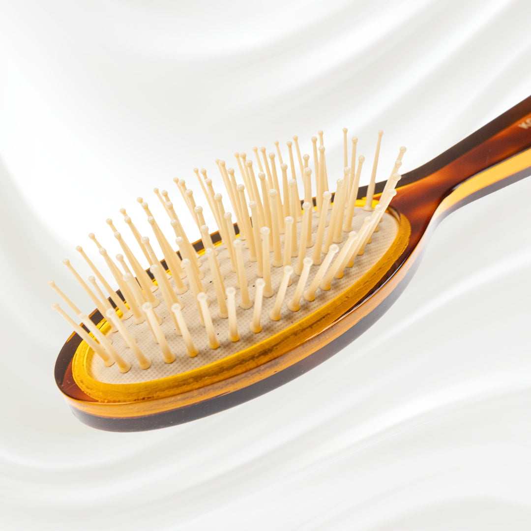 107G KOH-I-NOOR Jaspe small oval hairbrush with brown tortoiseshell acetate handle, and synthetic pins; KOH-I-NOOR's gold logo stamped on the handle