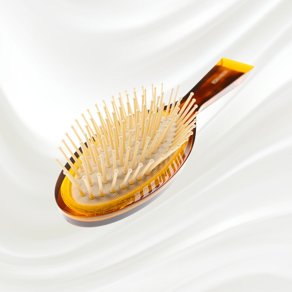 107G KOH-I-NOOR Jaspe small oval hairbrush with brown tortoiseshell acetate handle, and synthetic pins; KOH-I-NOOR's gold logo stamped on the handle