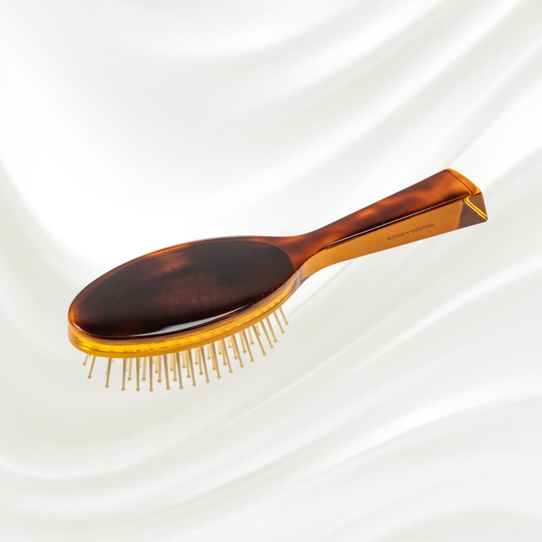 107G KOH-I-NOOR Jaspe small oval hairbrush with brown tortoiseshell acetate handle, and synthetic pins; KOH-I-NOOR's gold logo stamped on the handle
