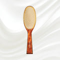 109 KOH-I-NOOR Jaspe large oval hairbrush with brown tortoiseshell acetate handle, and synthetic pins; KOH-I-NOOR's gold logo stamped on the handle