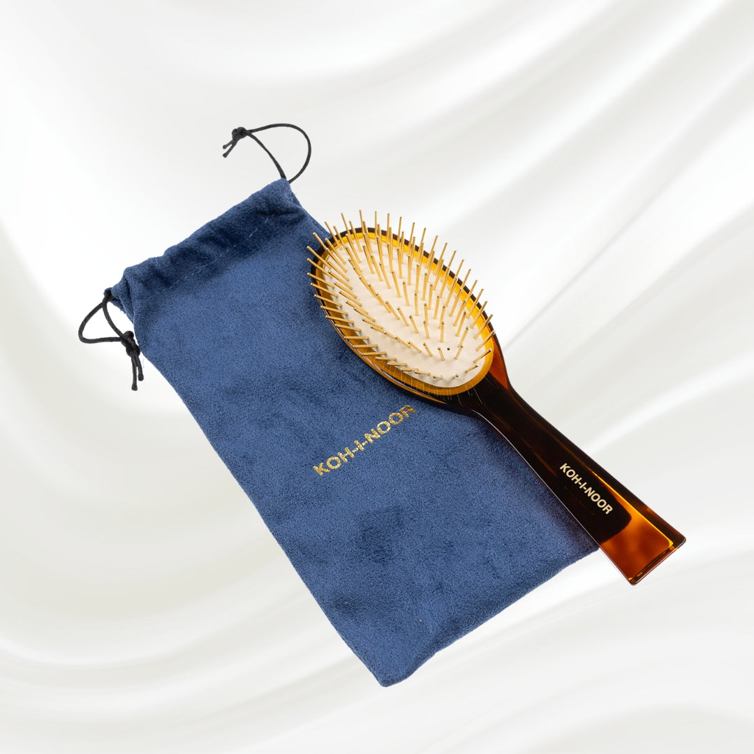 110C KOH-I-NOOR Jaspe large oval hairbrush with brown tortoiseshell acetate handle, and gold pins; KOH-I-NOOR's gold logo stamped on the handle. The brush is on a blue velvet bag.