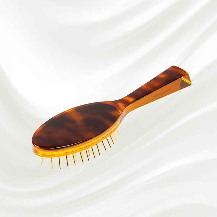 Brosse à cheveux pneumatique Jaspè avec picots en métal plaqué or