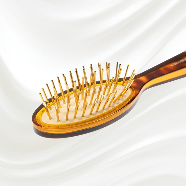 Brosse à cheveux pneumatique Jaspè avec picots en métal plaqué or