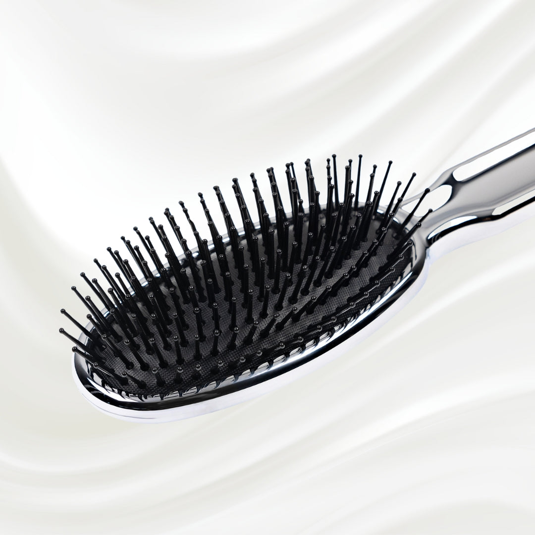 Brosse à cheveux pneumatique métallique ovale à picots synthétiques