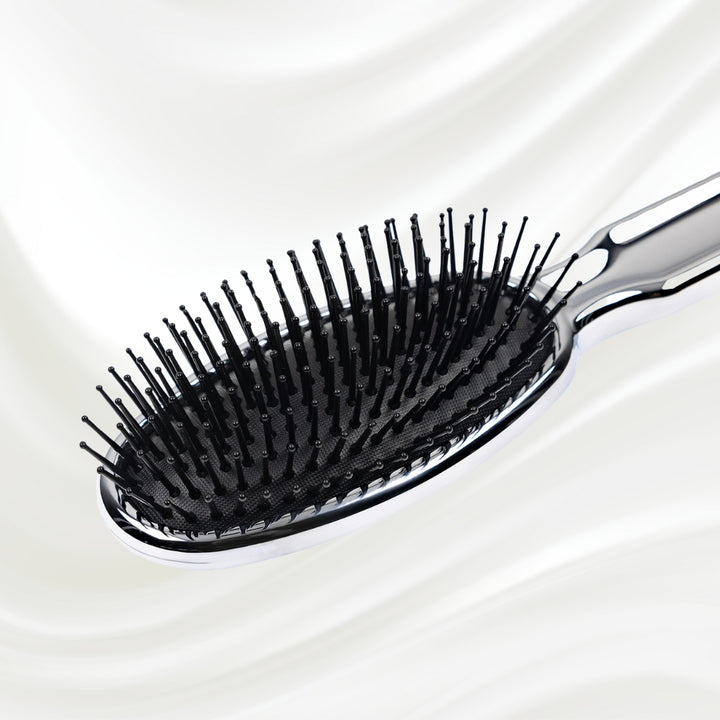 Brosse à cheveux pneumatique métallique ovale à picots synthétiques