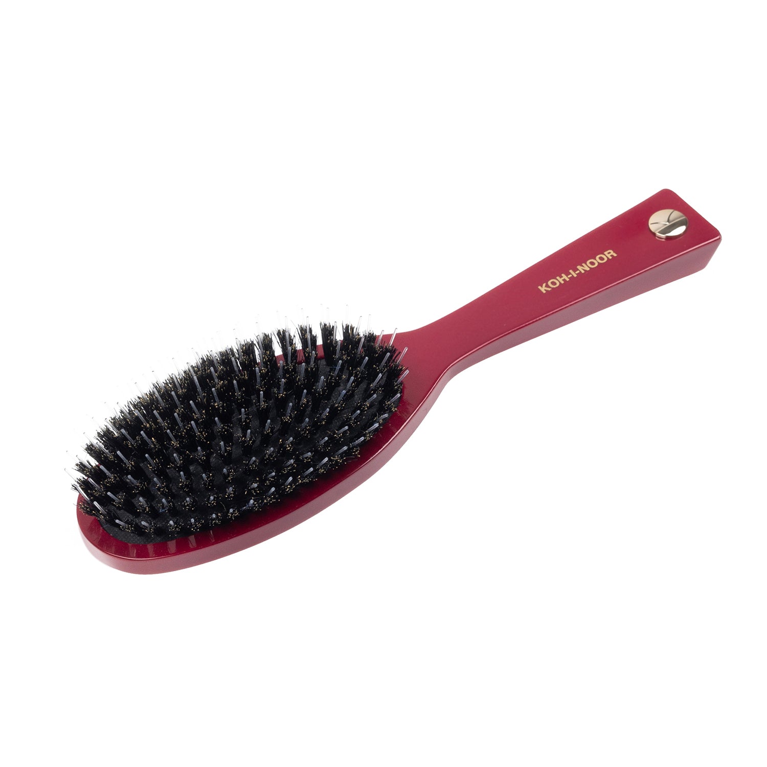 Red hairbrush with black bristles on a white background