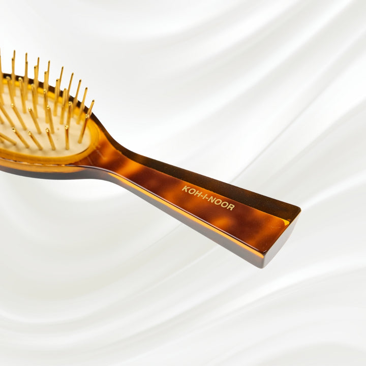 Brosse à cheveux pneumatique Jaspè avec picots en métal plaqué or