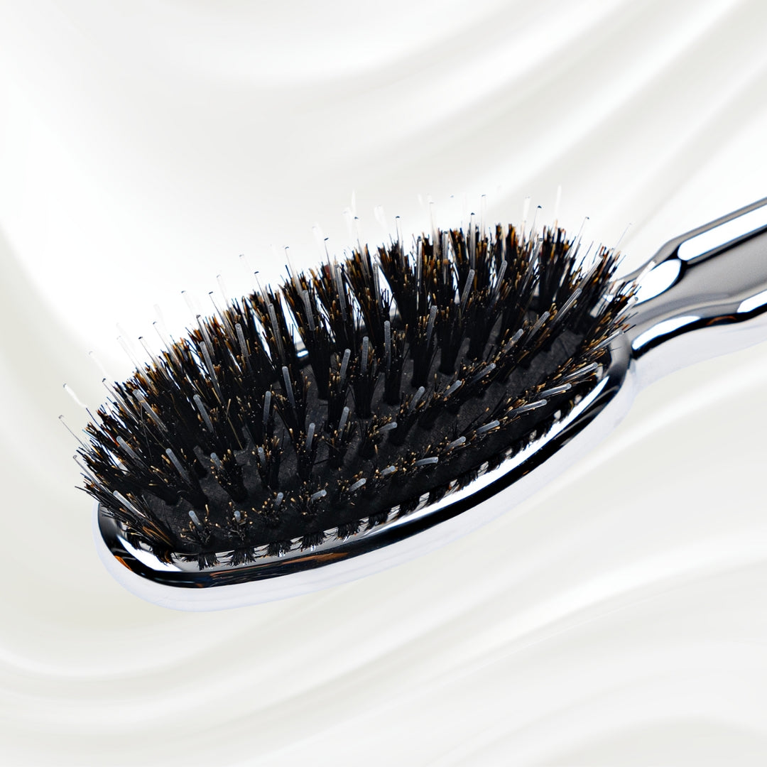 7117KK KOH-I-NOOR Metallic hairbrush with chrome plated handle, and boar and nylon bristles; KOH-I-NOOR's logo stamped on the comb
