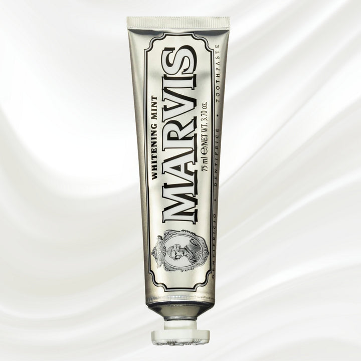 Marvis whitening mint toothpaste tube on a white background